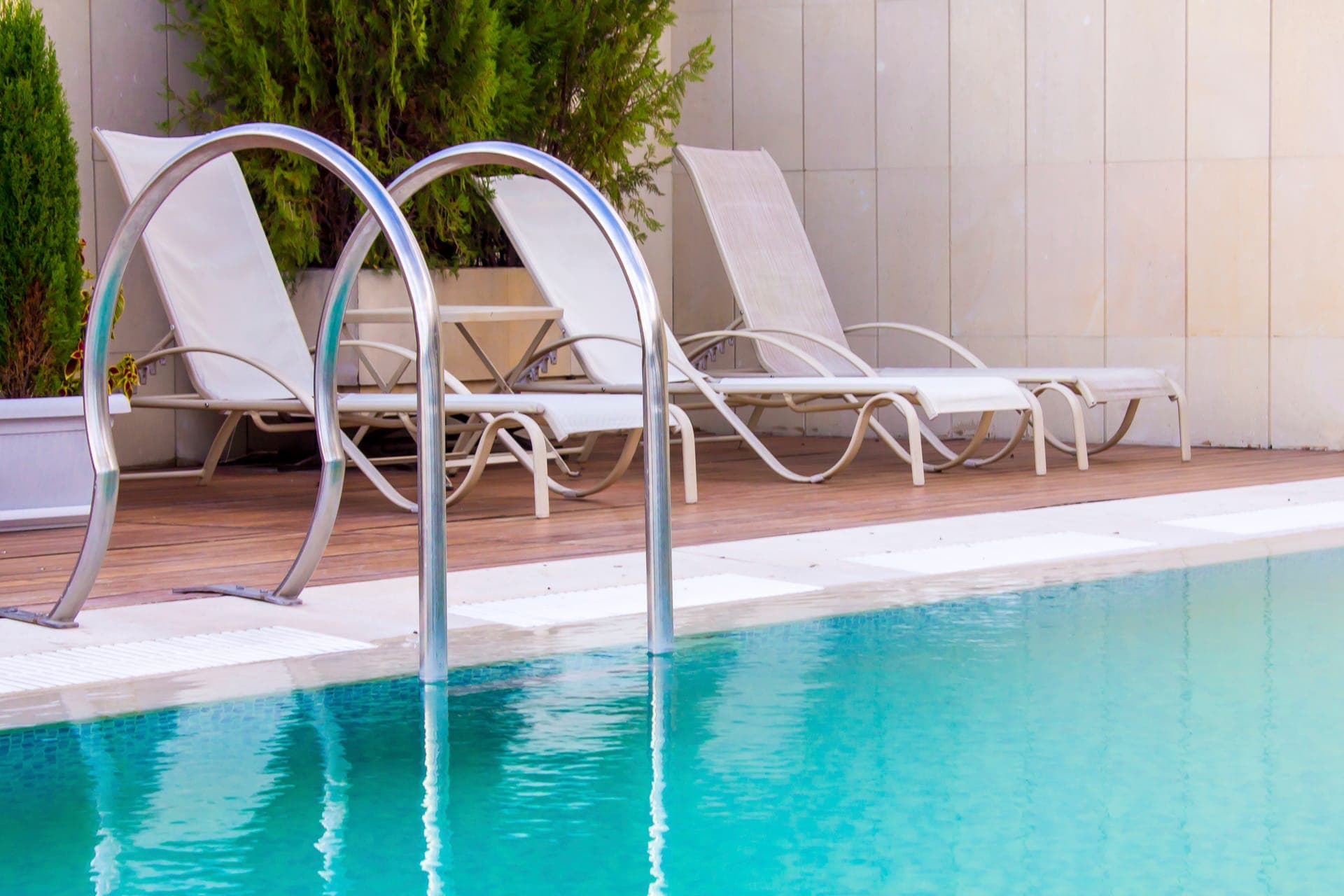 Poolside lounge chairs and patio setup for outdoor relaxation